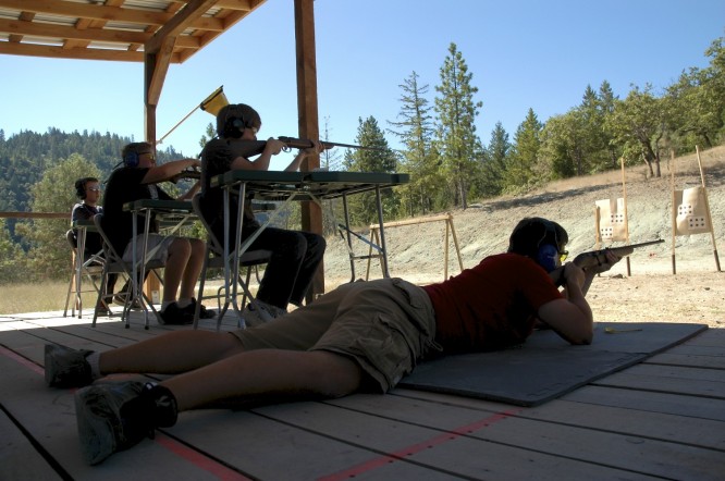 campers practicing riflery in both sitting and prone positions