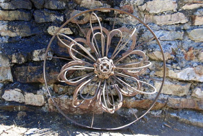 A garden decoration made of scrap metal welded into the shape of a flower