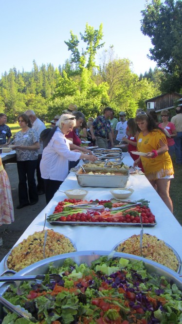 Visitors fill plates at the Community BBQ