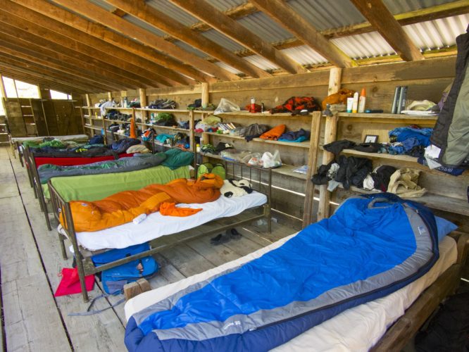 Sleeping Bags laid out on camp cots